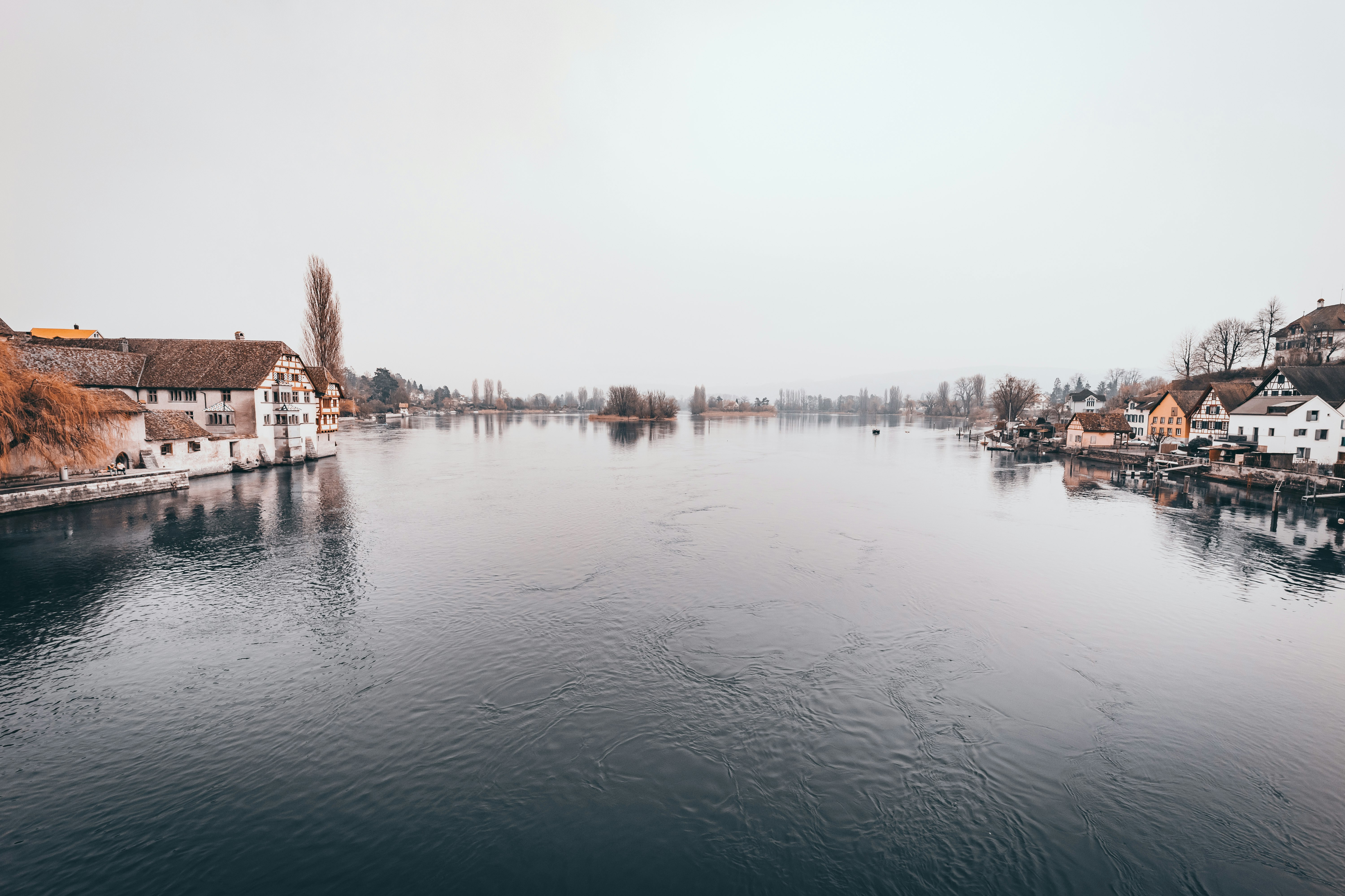 body of water near city buildings during daytime